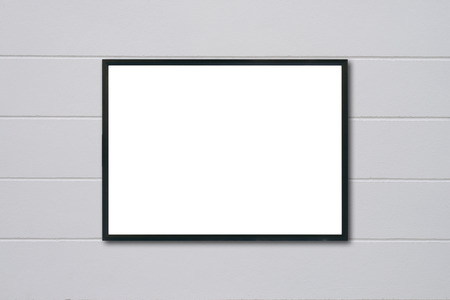 Mock up blank frame hanging on wall in roomの写真素材