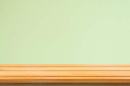 Empty top wooden shelves and stone wall background. Perspective brown wood shelves over stone wall background. - can be used for display or montage your products.Mock up for display of product.の写真素材