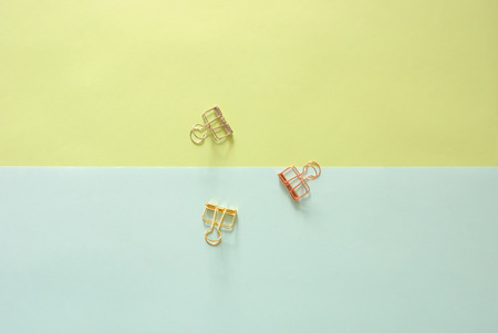 Minimal work space - Creative flat lay photo of workspace desk with paperclips on copy space pastel background. Top view , flat lay photography.の写真素材