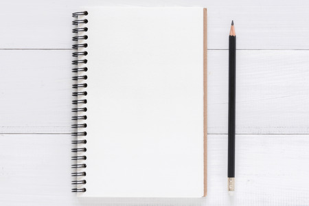 Minimal work space - Creative flat lay photo of workspace desk. White office desk wooden table background with open mock up notebooks and pens. Top view with copy space, flat lay photography.の写真素材