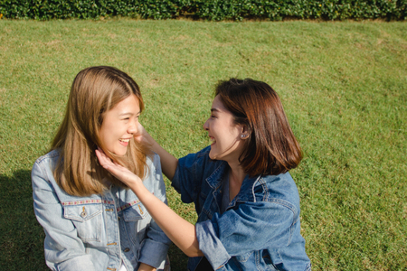 Group of young Asian women in an outdoor market in urban city, cheerful beautiful female feeling happy travel together. Lifestyle women travel holiday together concept.の写真素材