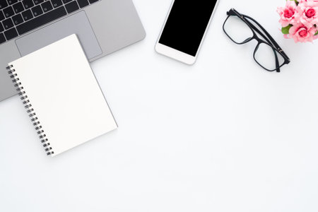 Creative flat lay photo of workspace desk. Top view office desk with laptop, glasses, phone,...