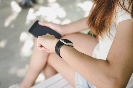Woman using smartwatch with e-mail notifier. smartwatch hand device notify computer internet message...