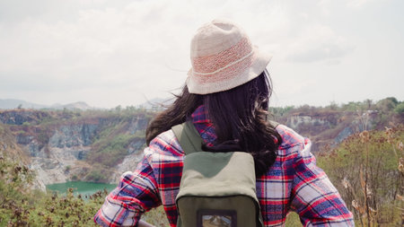 Hiker Asian backpacker woman walking to top of mountain, Female enjoy her holidays on hiking...
