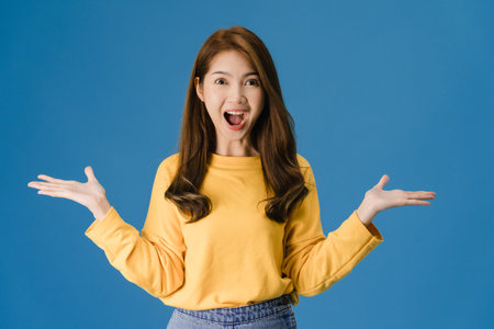 Young Asia lady feeling happiness with positive expression, joyful surprise funky, dressed in casual...