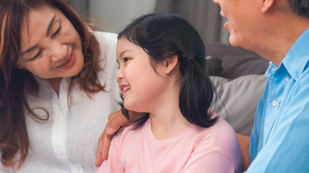 Asian grandparents talking with granddaughter at home. Senior Chinese, old generation, grandfather...