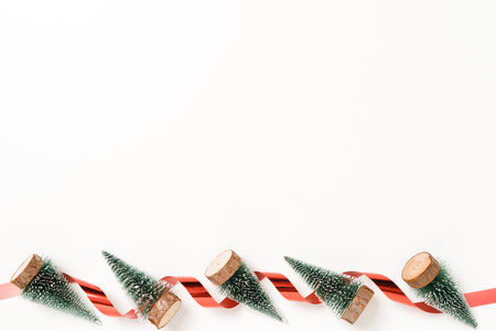 Minimal creative flat lay of christmas traditional composition and new year holiday season. Top view winter christmas decorations on white background with blank space for text. Copy space photography.