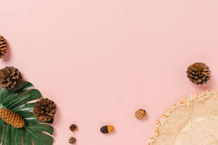 Creative flat lay photo of travel vacation spring or summer tropical fashion. Top view beach accessories on pastel pink color background with blank space for text. Top view copy space photography.の写真素材