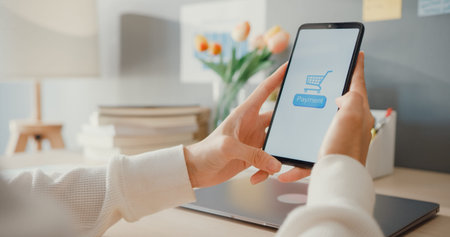 Young asia lady use cellphone order online shopping product and paying bills with banking app with...