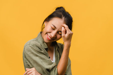 Young Asia lady with positive expression, joyful and exciting, dressed in casual cloth and look at...