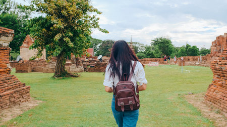 Traveler Asian woman spending holiday trip at Ayutthaya, Thailand, Japanese backpacker female enjoy...