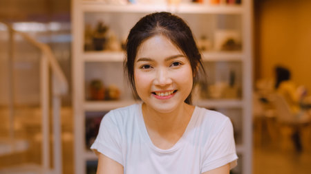 Freelance Asian women using mobile phone at office. Young Japanese Asia Girl using smartphone...