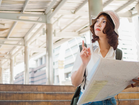 Freelance Asian women using mobile phone at office. Young Japanese Asia Girl using smartphone...