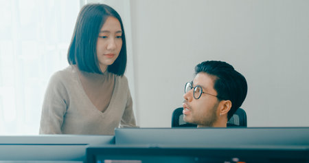 Group Adult Asia male, female freelance meeting write prompt AI bot IT app smart program nomad, video game, talk strategy, discuss plan, user interface, designer, big data center on desktop computer.の写真素材