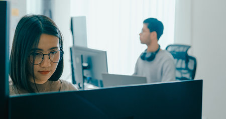 Group Adult Asia male, female freelance typing write prompt AI bot IT app smart program nomad, video game, terminal with coding language, user interface, designer, big data center on desktop computer.の写真素材