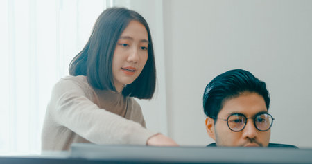 Group Adult Asia male, female freelance meeting write prompt AI bot IT app smart program nomad, video game, talk strategy, discuss plan, user interface, designer, big data center on desktop computer.の写真素材