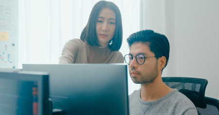 Group Adult Asia male, female freelance meeting write prompt AI bot IT app smart program nomad, video game, talk strategy, discuss plan, user interface, designer, big data center on desktop computer.の写真素材