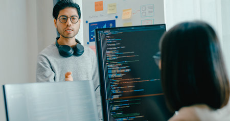Group adult Asia male female software developers mentor leader manager talk strategy plan to executive write prompt AI bot IT app program nomad, whiteboard slideshow code.の写真素材