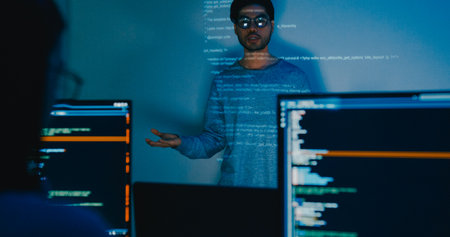Group adult Asia male software developers mentor leader manager talk strategy plan to executive write prompt AI bot IT app program nomad, video game, designer, data center. Projecting slideshow code.の写真素材
