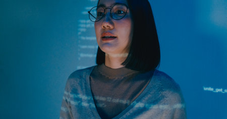 Group adult Asia female software developer mentor leader manager talk strategy plan to executive write prompt AI bot IT app program nomad, video game, designer, data center. Projecting slideshow code.の写真素材