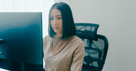 Young adult Asia female freelance typing write prompt AI bot IT app smart program nomad, video game, terminal with coding language, user interface, designer, big data center on desktop computer.の写真素材