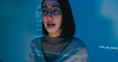 Group adult Asia female software developer mentor leader manager talk strategy plan to executive write prompt AI bot IT app program nomad, video game, designer, data center. Projecting slideshow code.の写真素材