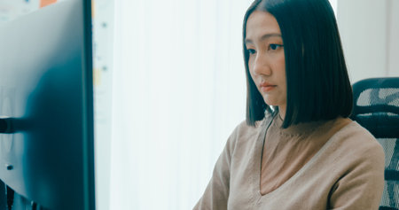 Closeup Adult Asia female freelance typing write prompt AI bot IT app smart program nomad, video game, terminal with coding language, user interface, designer, big data center on desktop computer.の写真素材