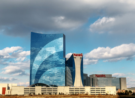 Atlantic City, NJ, December 10, 2016: The Harrah's hotel and casino is seen under blue sky with clouds.のeditorial素材