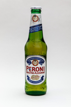 New York, January 5, 2017: A bottle of Peroni beer is seen against white background.のeditorial素材