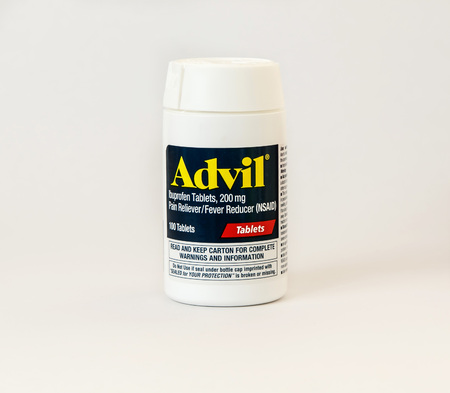 New York, December 02: A bottle of Advil pain reliever pills isolated on white.のeditorial素材