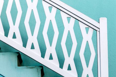 Detail of an outside staircase, white and cyan.の写真素材
