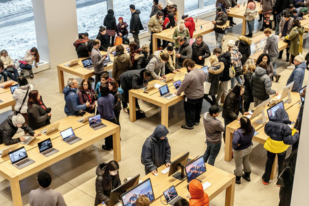 New York, February 9, 2017: People are browsing inside Apple store on 5th Avenue.のeditorial素材