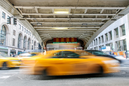 New York, February 21, 2017: Blurred view of taxis moving along the 42nd street at Pershing Square.のeditorial素材