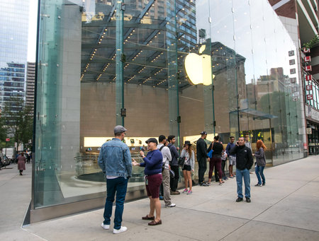New York, September 28, 2016: People are lining up in front of an Apple store in anticipation of its opening.のeditorial素材