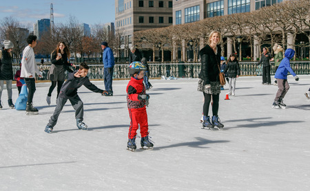 New York, February 26, 2017: People are skating on the Brookfield skating rink in downtonw Manhattan.のeditorial素材