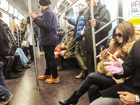 New York, Februrary 17, 2017: Passengers are riding NYC subway.のeditorial素材