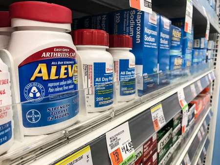 New York, December 15: Aleve and other pain relievers on a pharmacy shelf.のeditorial素材