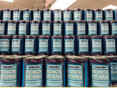 New York, Februrary 14, 2017: Cans of Black Beans are stacked on a shelf in a Trader Joe's store.