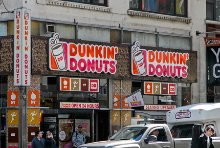 New York, May 08, 2017: Exterior signs on one of Dunkin Donuts locations in Manhattan.のeditorial素材