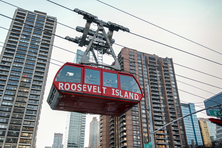 New York, February 6, 2017: One of the two Roosevelt Island Tram gondolas is traveling in the direction of Manhattan.のeditorial素材