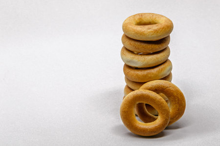 Stack of Russian bread rings isolated on light background.