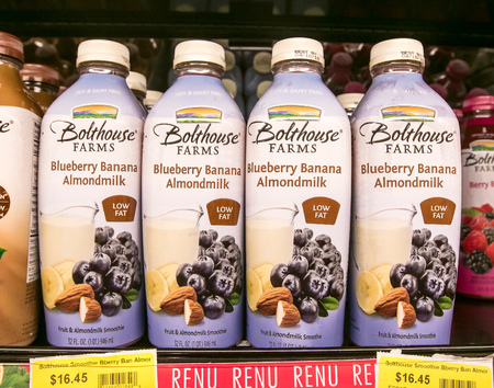 Holetown, Barbados, 03-19-2018: Bottles of Bolthouse Farms' Blueberry Banana Almondmilk stand on a shelf of a local supermarket.のeditorial素材