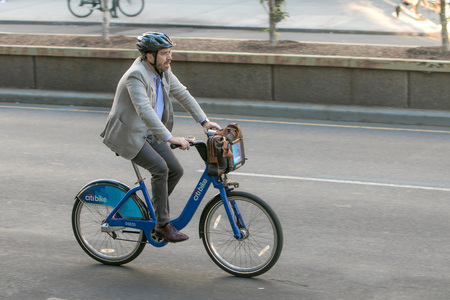 New York, September 12, 2016: A man is riding a bicycle along Park Avenue in Manhattan.のeditorial素材