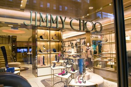 New York, October 15, 2018: View of the inside of a Madison Avenue Jimmy Choo store through its front window.のeditorial素材