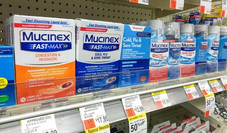 New York, 2/14/2019: Packs of Mucinex stand on a shelf in a drug store.のeditorial素材