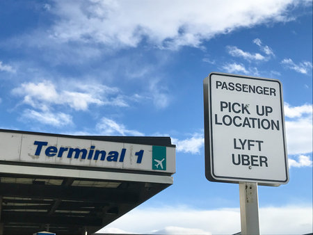 Salt Lake City, UT, 2/4/2019: Sign for the Uber and Lyft designated pick up stop at SLC's Terminal...