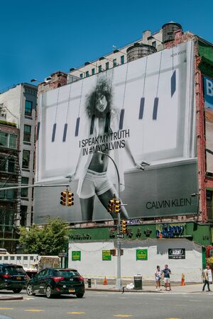 New York, 6/15/2019: View of a large Calvin Klein billboard set up on a side of a building along Houston Street.のeditorial素材