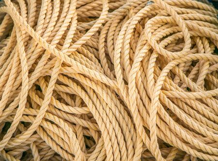 Maritime rope lying in disorderly manner, background.の写真素材