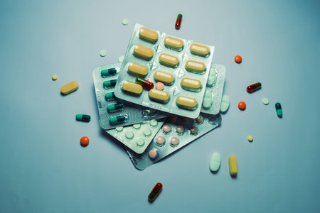 Pills on blue table Colourful pills