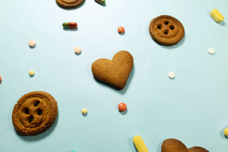 Homemade chocolate hearth shaped cookies and pillsの写真素材